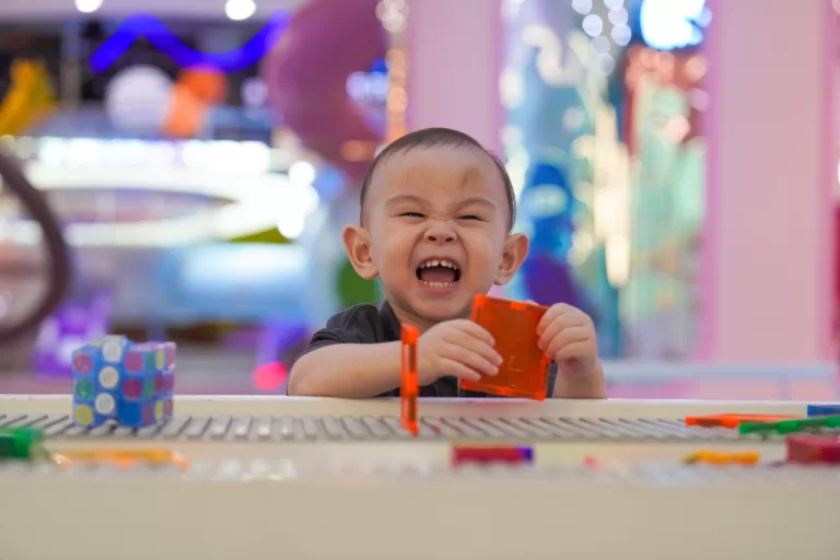 Toddler laughing while playing at UFOREA Penang