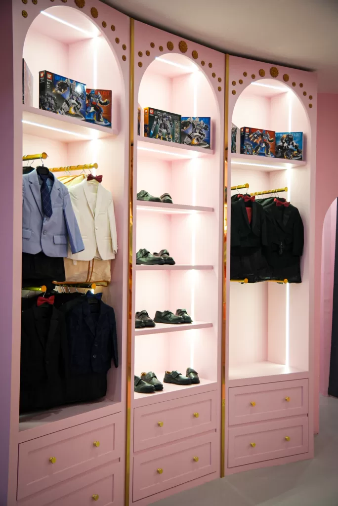 Wardrobe of pastel princess gowns and prince capes at UFOREA Makeover Castle